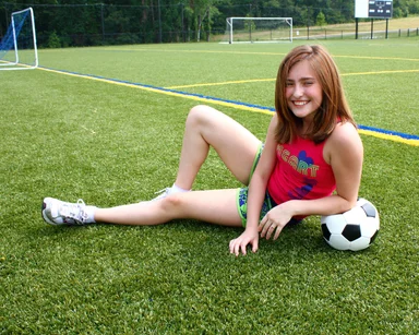 Free Stock Photo: A cute young girl posing with a soccer ball