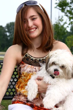 Free Stock Photo: A young girl holding a small dog