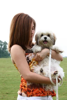 Free Stock Photo: A cute young girl holding a dog