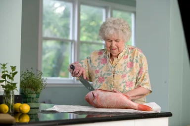 Free Stock Photo: An elderly woman preparing fresh fish