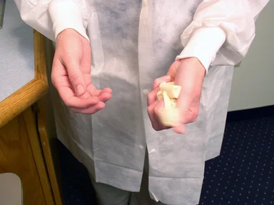 Free Stock Photo: A lab technician discarding disposable gloves