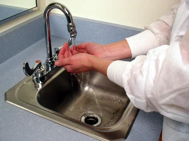 Free Stock Photo: A lab technician washing her hands