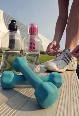 Free Stock Photo: A healthy young woman tying her laces before exercise