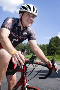 Free Stock Photo: A young man riding a bicycle