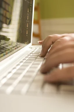 Free Stock Photo: Female hands typing on a laptop keyboard