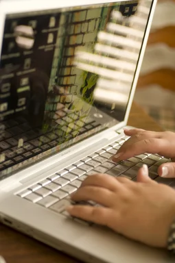 Free Stock Photo: Female hands typing on a laptop keyboard