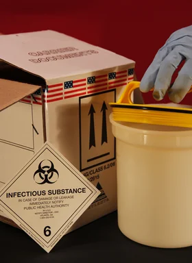 Free Stock Photo: A gloved hand opening a biohazard container