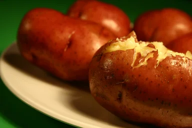 Free Stock Photo: Close up of a plate of baked potatoes