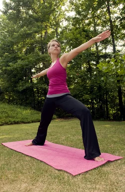 Free Stock Photo: A young woman stretching before exercise