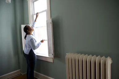 Free Stock Photo: An African-American woman cleaning a window