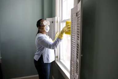 Free Stock Photo: An African-American woman cleaning a window
