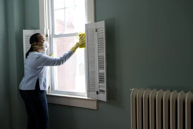 Free Stock Photo: An African-American woman cleaning a window