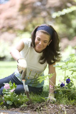 Free Stock Photo: A woman enjoying gardening outdoors