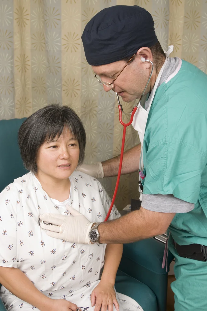 A female patient being examined by her doctor : Free Stock Photo