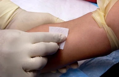 Free Stock Photo: A patient having blood drawn from a doctor