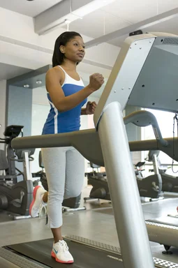 Free Stock Photo: A woman running on a treadmill