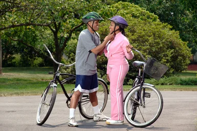 Free Stock Photo: An African-American couple preparing to ride bikes