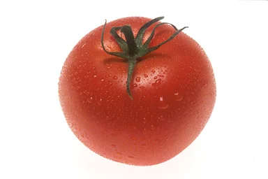 Free Stock Photo: A whole red tomato isolated on a white background