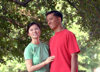 Free Stock Photo: An asian couple smiling at each other outdoors