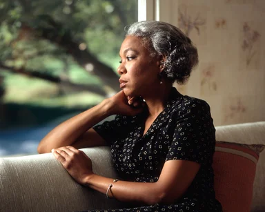 Free Stock Photo: An African-American woman looking out a window