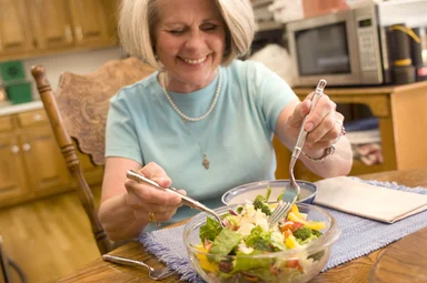 Free Stock Photo: A woman eating a fresh salad