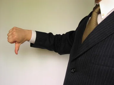 Free Stock Photo: Business man in a suit giving thumbs down