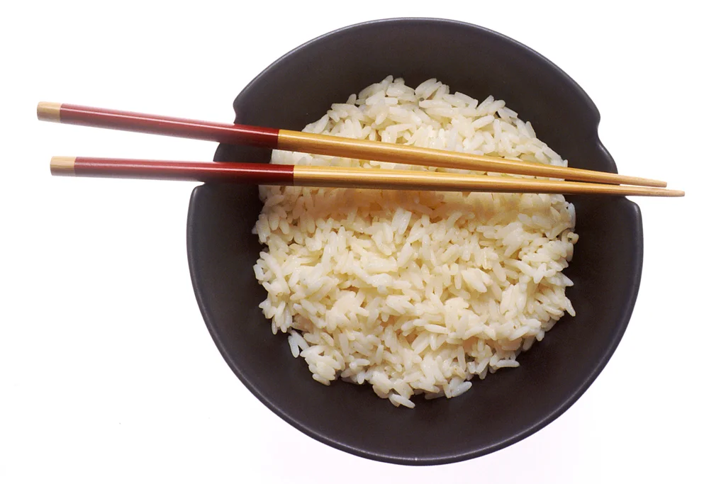 A bowl of rice with chopsticks : Free Stock Photo