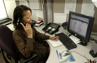 Free Stock Photo: An African American woman working at her desk