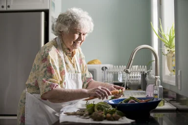 Free Stock Photo: An elderly woman washing produce