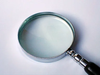 Free Stock Photo: Magnifying glass on a white background