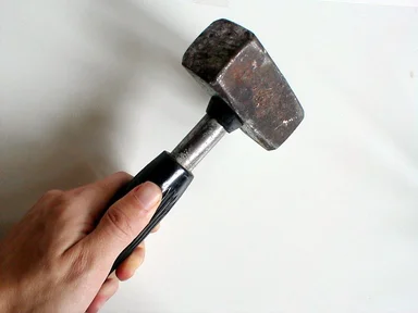 Free Stock Photo: Hand holding a worn mallet