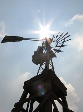 Free Stock Photo: An old farm windmill shining under the sun