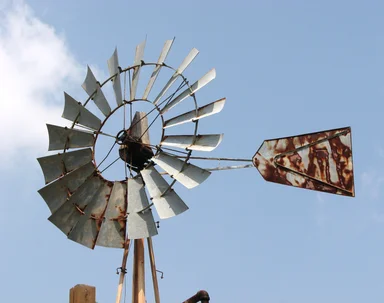 Free Stock Photo: An old farm windmill in a blue sky