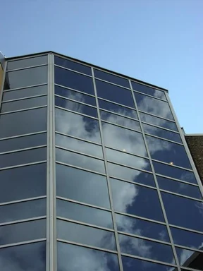 Free Stock Photo: Sky reflecting off a glass building