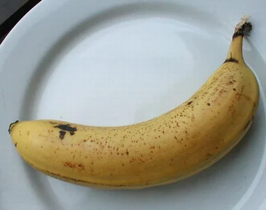 Free Stock Photo: Closeup of a banana on a white plate