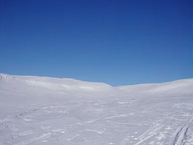 Free Stock Photo: Solid blue sky from top of snow covered mountain