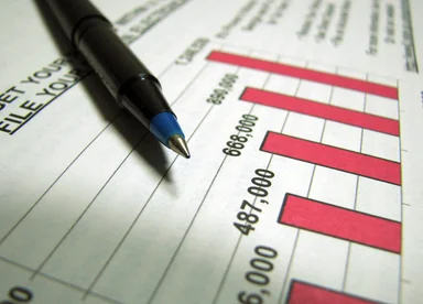 Free Stock Photo: Closeup of a tax income graph and pen