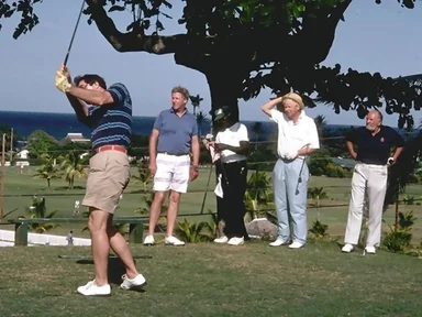 Free Stock Photo: A group of men playing golf by the ocean