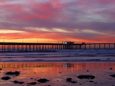 Free Stock Photo: A pier over the ocean at sunset