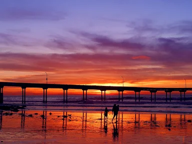 Free Stock Photo: A pier over the ocean at sunset