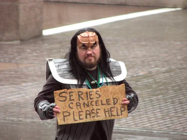 Free Stock Photo: A man in a Klingon costume with sign in the rain in the 2009 Atlanta Saint Patricks Day Parade