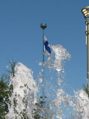 Free Stock Photo: Finnish flag near fountain