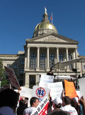 Free Stock Photo: Protest flags and signs in front of the State Capitol building at the 2009 tax day tea party in Atlanta, Georgia