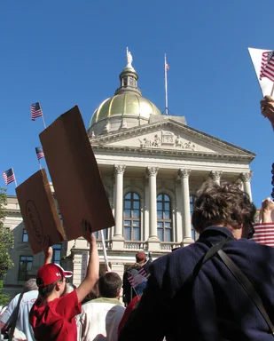 Free Stock Photo: Protesters with signs in front of the State Capitol building at the 2009 tax day tea party in Atlanta, Georgia