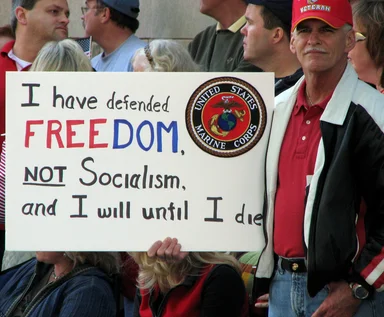 Free Stock Photo: A war veteran with a sign at the 2009 tax day tea party in Atlanta, Georgia