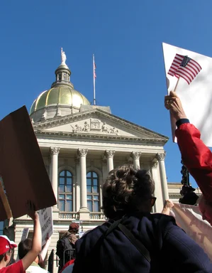Free Stock Photo: Protesters with signs in front of the State Capitol building at the 2009 tax day tea party in Atlanta, Georgia