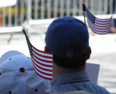 Free Stock Photo: Protesters with flags in their hats at the 2009 tax day tea party in Atlanta, Georgia