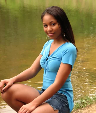 Free Stock Photo: A beautiful African American teen girl posing by a lake