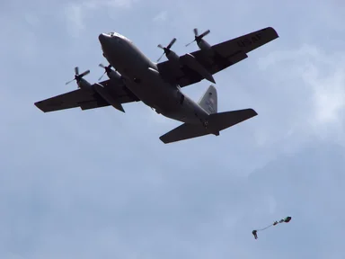 Free Stock Photo: Soldiers parachuting from a C-130 military plane