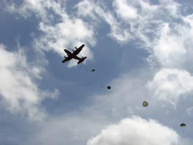 Free Stock Photo: Soldiers parachuting from a C-130 military plane